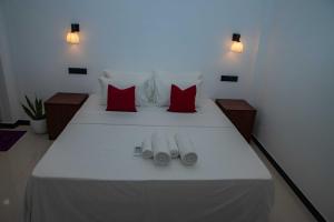 Postel nebo postele na pokoji v ubytování Randon Resort Mirissa