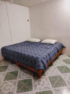 Ein Bett oder Betten in einem Zimmer der Unterkunft Cómodo Departamento a 2 cuadras de la playa