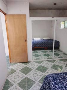 Ein Bett oder Betten in einem Zimmer der Unterkunft Cómodo Departamento a 2 cuadras de la playa