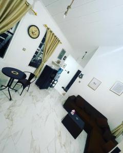 a living room with a floor covered in marble at Villa Omar in Cikujang