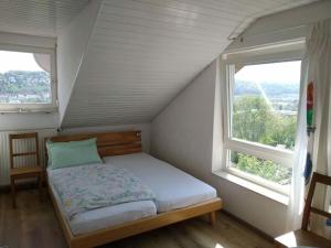 Ένα ή περισσότερα κρεβάτια σε δωμάτιο στο Holiday apartment Wiedmann