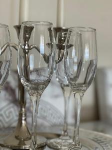 a group of wine glasses sitting on a table at Victoria City View in Victoria