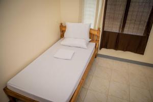 Postel nebo postele na pokoji v ubytování Fardesam - Budget Friendly Guest House
