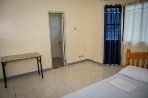 Postel nebo postele na pokoji v ubytování Fardesam - Budget Friendly Guest House