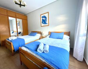 A bed or beds in a room at Tranquilo apartamento cerca del Casco Viejo Bilbao