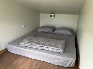 Postel nebo postele na pokoji v ubytování Pai Chao Kha