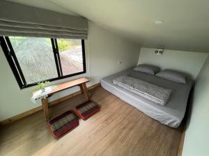 Postel nebo postele na pokoji v ubytování Pai Chao Kha