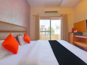 Postel nebo postele na pokoji v ubytování Hotel Anuvibha Malviya Nagar