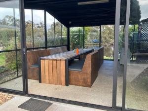 a pavilion with a bench in the middle of it at C and C Backpack in Stawell
