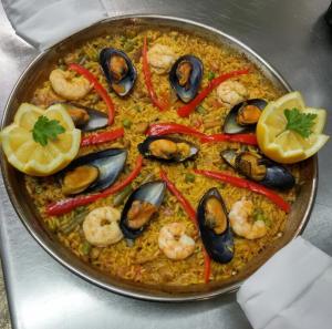 a pan of food with shrimp and other vegetables at Hotel La Colombina in San Sebastián de la Gomera