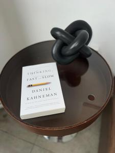 a book sitting on top of a table with a chain at Historic Downtown LA Loft - Urban Charm in Los Angeles