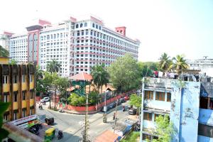 an overhead view of a city street with tall buildings at Court View Homestay in Cochin