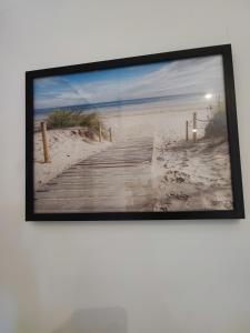 a picture of a boardwalk to the beach at APPART'HOTEL EDEN in Béthune