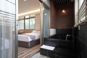 Voodi või voodid majutusasutuse Hoya Hot Springs Resort, Guanziling toas