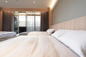 Voodi või voodid majutusasutuse Hoya Hot Springs Resort, Guanziling toas