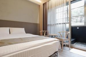 Voodi või voodid majutusasutuse Hoya Hot Springs Resort, Guanziling toas
