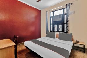 Cama ou camas em um quarto em OYO Flagship 84744 Sk Guest House