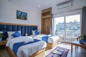 Giường trong phòng chung tại Tripli Hotels Ayushman Retreat