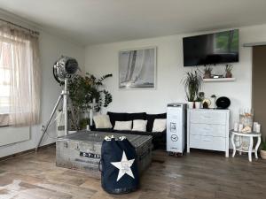 a living room with a couch and a tv at Vista Suites 1-2 in Budapest +54 photos