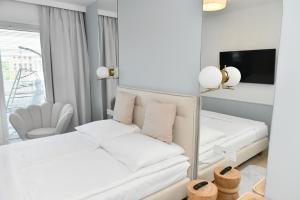 Posteľ alebo postele v izbe v ubytovaní Apartament A101 Polanki Aqua