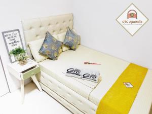 Letto o letti in una camera di GTC Apartelle