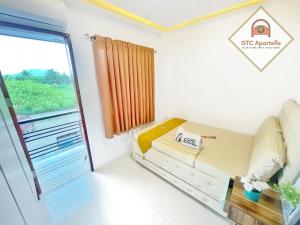 Letto o letti in una camera di GTC Apartelle