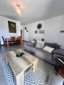 a living room with a couch and a table at 83/3-Lovely 1 Bedroom Penthouse in Birkirkara