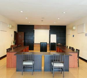 a large room with a bar with chairs in it at GRAND FAR EAST HOTEL SDN BHD in Masai