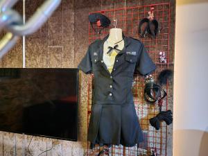 a shirt and tie on a mannequin on a rack at NW 4896 Theater Hotel in Ban Khlong Phruan