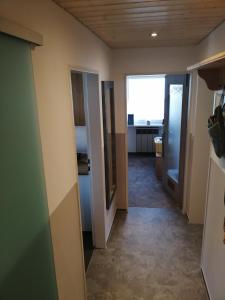 a hallway leading to a room with a door at Ferienwohnung Gruberhörndlblick in Inzell