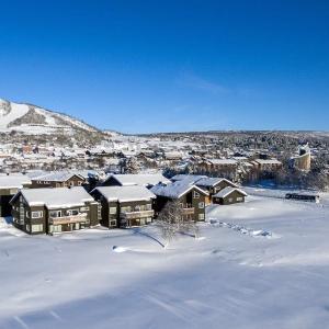 a town covered in snow with houses at Sentral leilighet på Geilo in Geilo