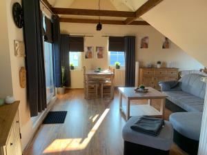 a living room with a couch and a table at Ferienwohnung Baumann in Schwarzenberg