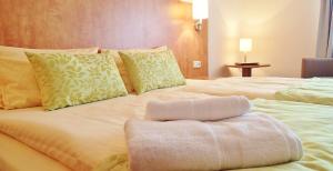 Postel nebo postele na pokoji v ubytování Hotel Mingarden