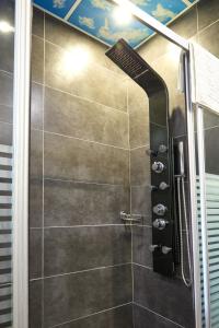 a shower with a glass door in a bathroom at By Aydın Suites in Istanbul