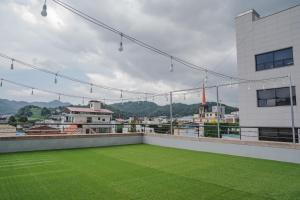 a view from the roof of a building with a lawn at JEONJU HOTEL THE VINCENT in Jeonju