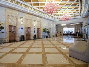 a large room with a large lobby with a large marble floor at Regency Hotel in Dongguan