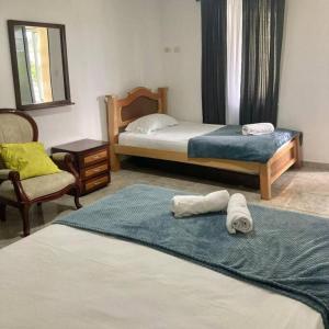 Tempat tidur dalam kamar di Hotel Campestre Cafetal - Quindio - EJE CAFETERO