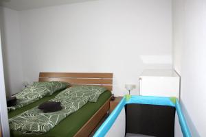 En eller flere senge i et værelse på Ferienwohnung Mars FN