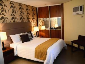 a hotel room with a large bed in a room at GT Hotel Bacolod in Bacolod +71 photos
