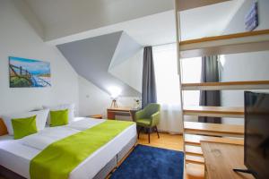 Postel nebo postele na pokoji v ubytování Inselhotel kleiner Bodden