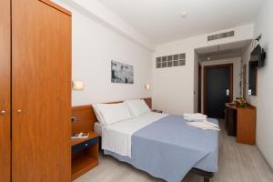 Postel nebo postele na pokoji v ubytování Hotel La Sirenetta + 30 fotografií