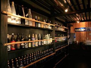 a room filled with lots of bottles of alcohol at Miyakonojo Sun Plaza Hotel in Miyakonozyō