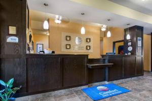 a lobby with a bar with a blue rug at Comfort Inn & Suites in Virden