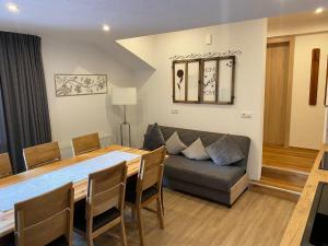 a living room with a table and a couch at Apartment Auszeit in Brandberg