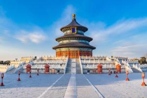 a large building with a tower in the middle at 7 Days Inn Beijing South Railway Station in Beijing