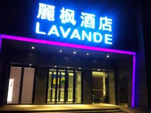 a neon sign on the front of a building at Beijing Lavande Hotel Shunyi Subway Station Branch in Shunyi