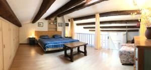 a bedroom with a bed and a table in it at 89 Le Grand Pin in Sainte-Maxime