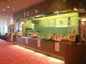 a fast food restaurant with a counter with signs on it at Hokkaido Futomi Meisen Manyo no Yu in Ishikari