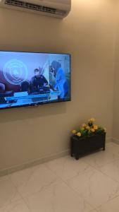 a flat screen tv hanging on a wall at شقة فاخرة مودرن in Al Kharj