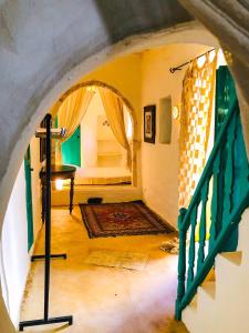 a view of a room with a bed and a staircase at Dar Kenza in Djerba